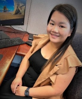 Picture of Mai at her desk